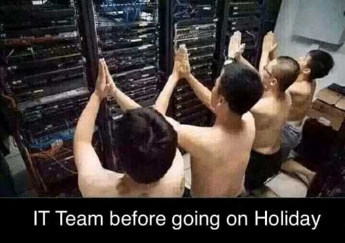 there are three men in a room with a rack of servers