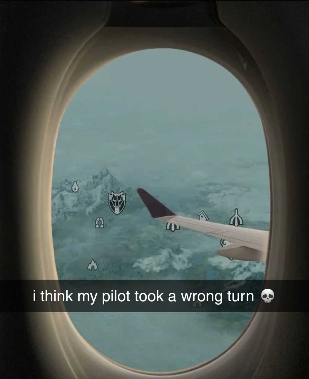 there is a picture of a plane window with a picture of a plane flying over the mountains