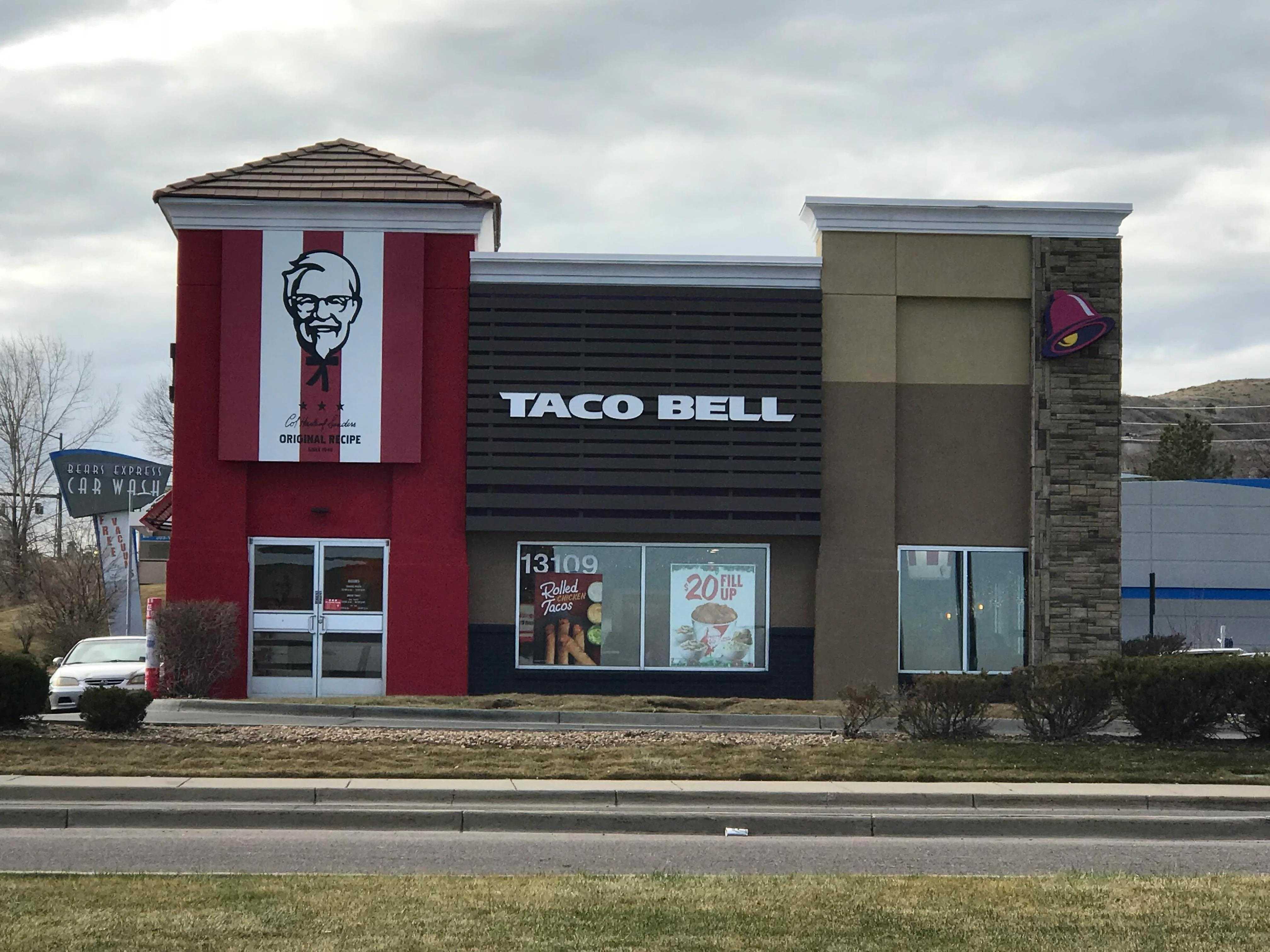 building with a taco bell sign on the side of it