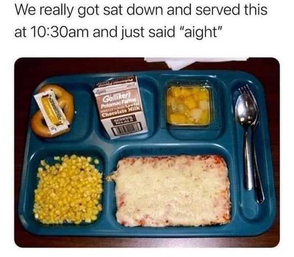 a close up of a tray with food on it with a fork