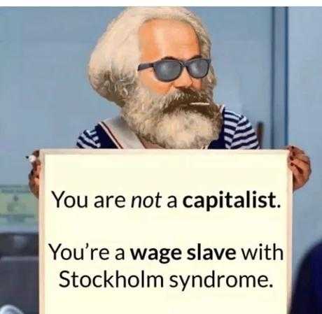 man with a sign that says, you are not a capitalist you ' re a wage slave with stockholm syndrome