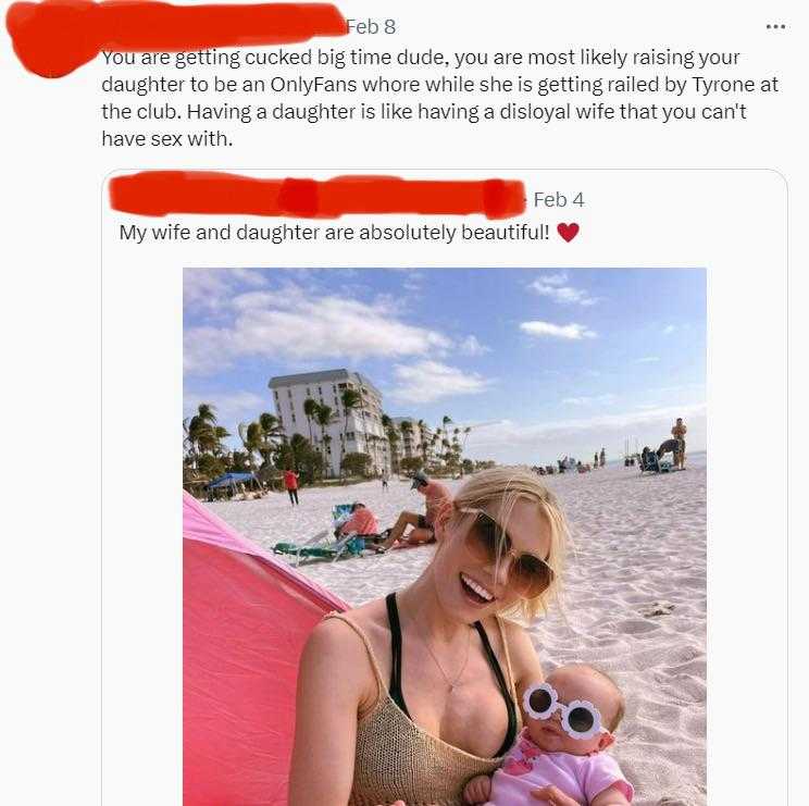 a woman in a bikini top holding a baby on a beach