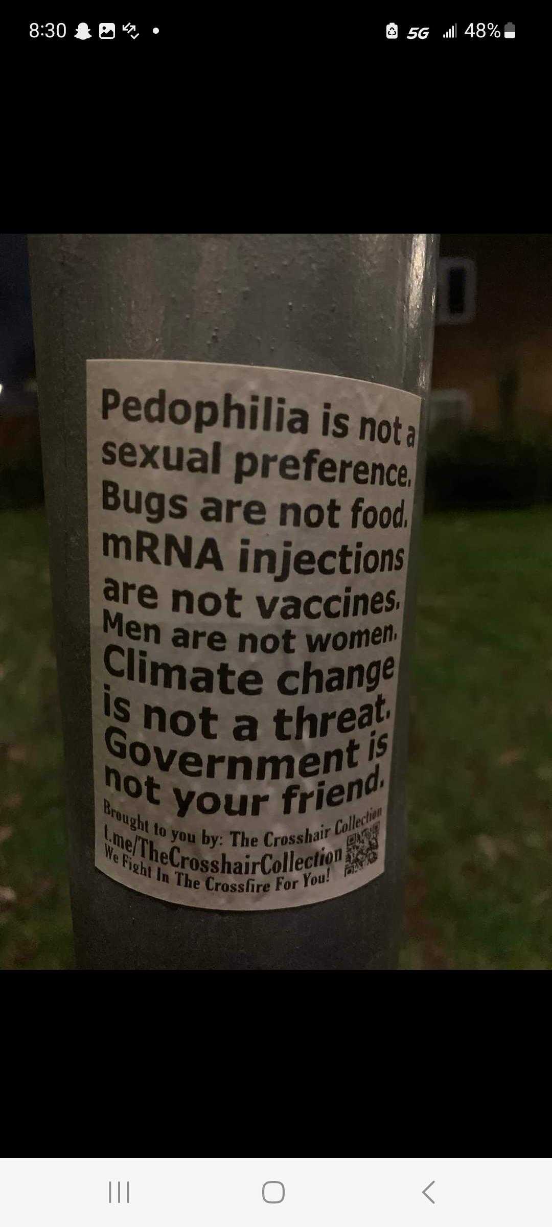 there is a sticker on a pole that says,