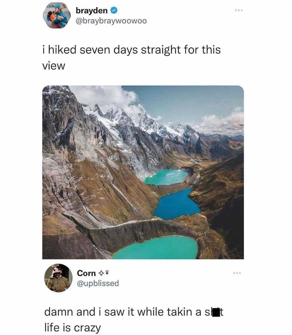 a close up of a person on a phone with a mountain in the background