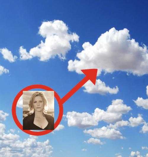 there is a picture of a woman in a black shirt in the sky