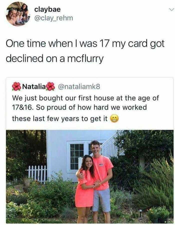 a couple of people standing next to each other in front of a house