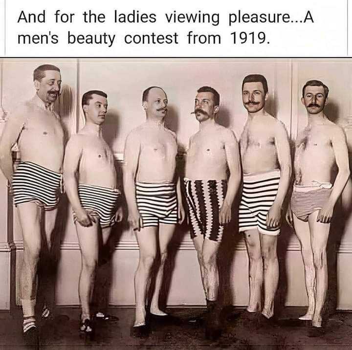 there are five men in striped trunks standing next to each other