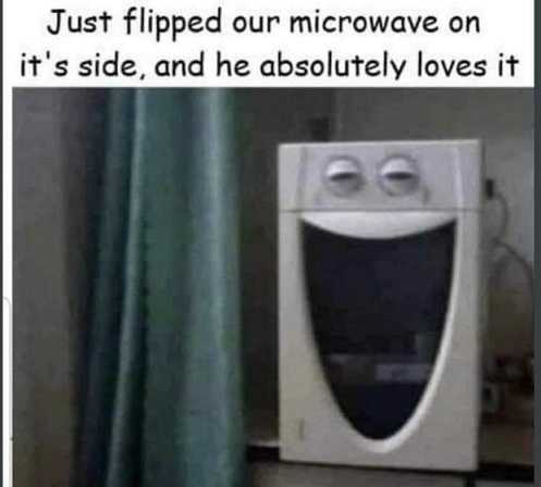 there is a microwave with a funny face on it