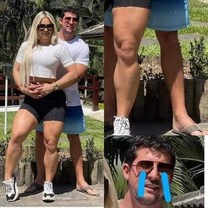 man and woman posing for a picture with a blue toothbrush