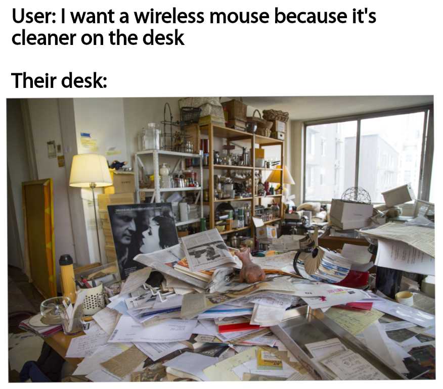 there is a messy desk with a computer and many papers