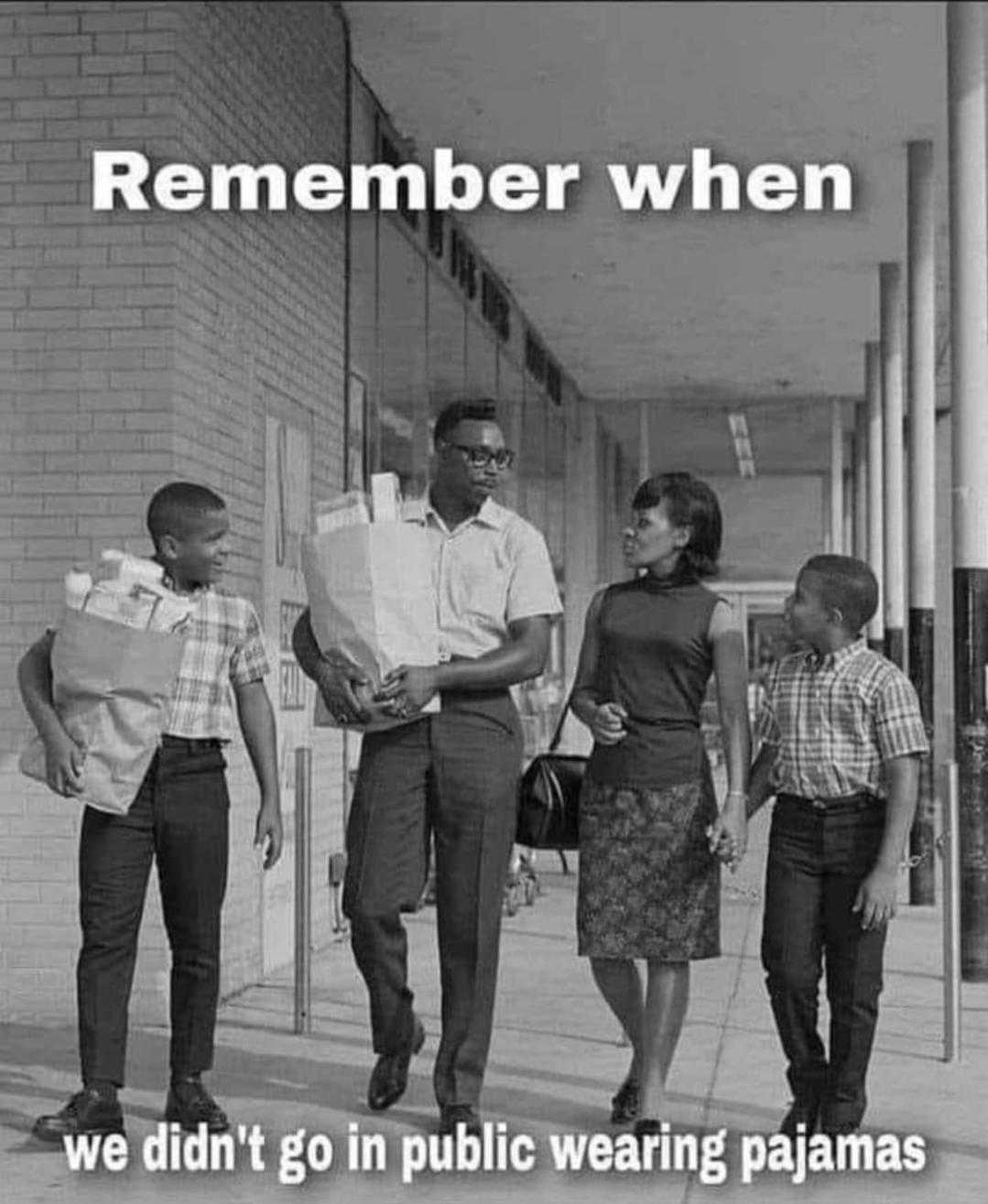 image of a group of people walking down a sidewalk