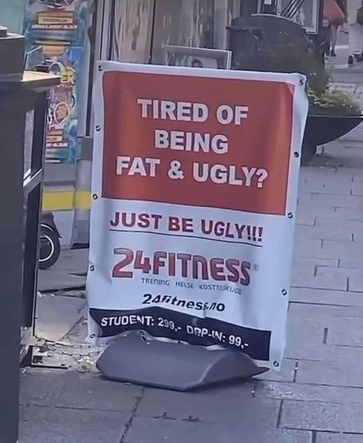 there is a sign that says tired of being fat and ugly