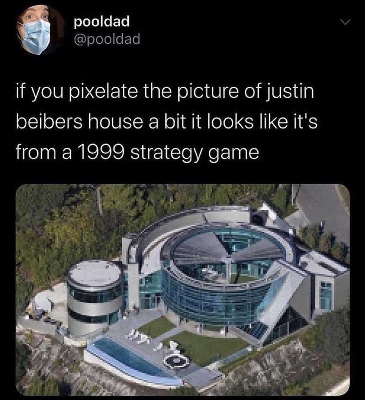 a close up of a building with a pool and a face mask on