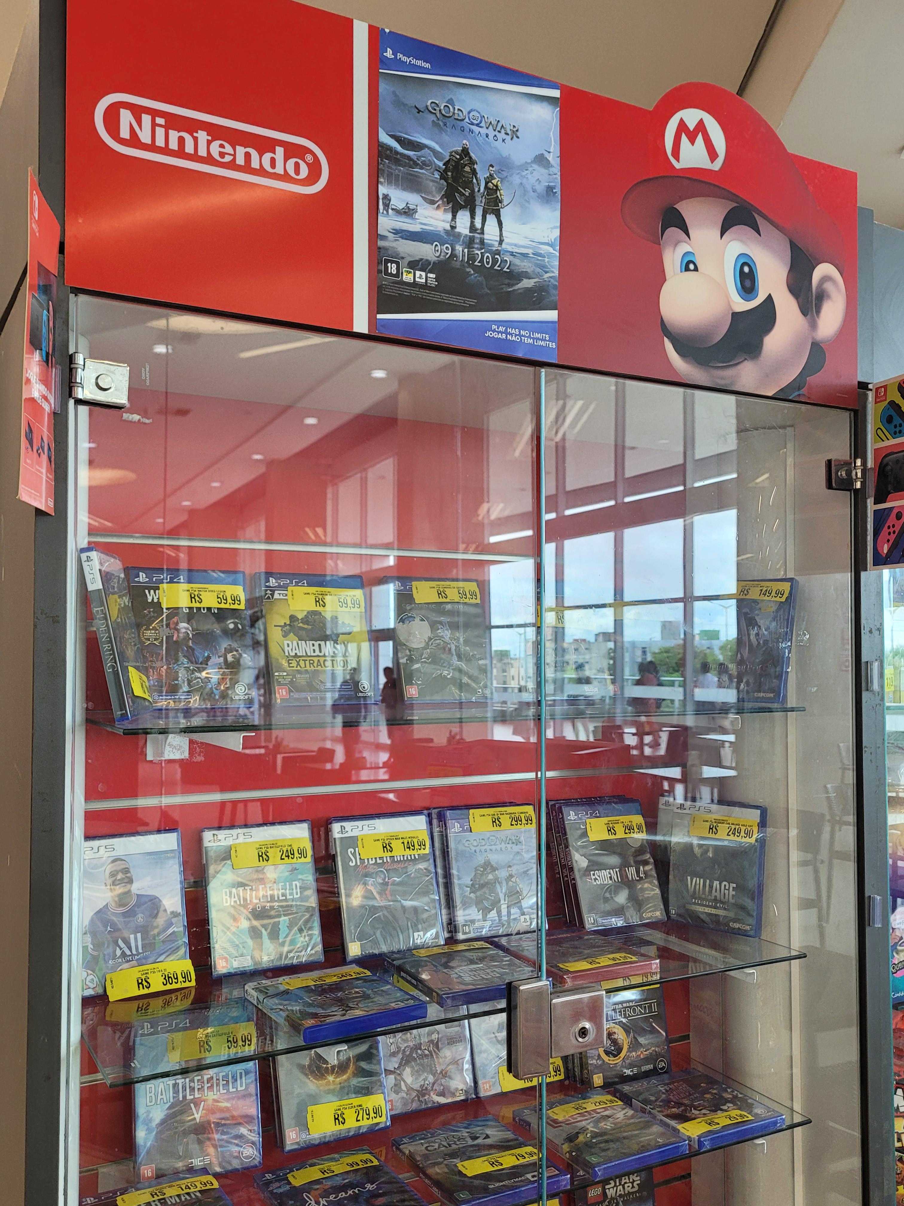 there is a nintendo wii game display in a store