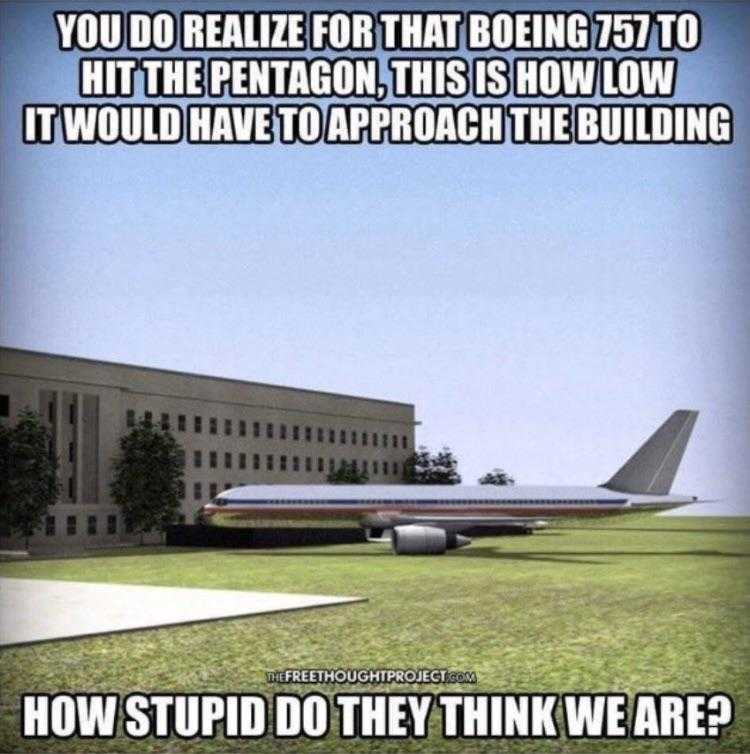 airplane sitting on the ground in front of a building