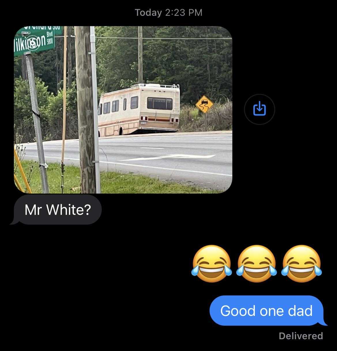 a close up of a text message with a bus on the road