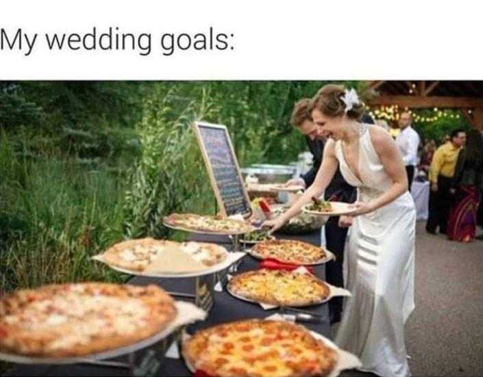 there are many pizzas on the table and a woman is serving them