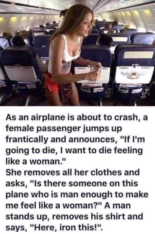 a woman in a white tank top standing on an airplane