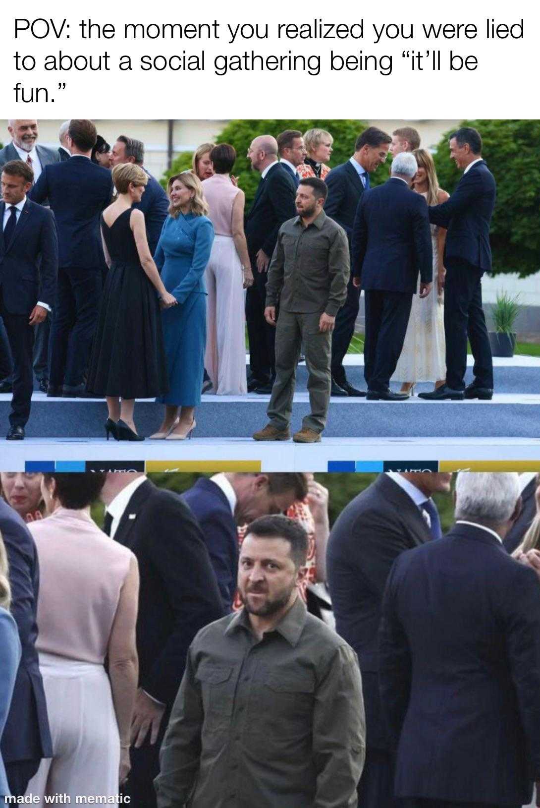 a couple of people standing around a crowd of people in suits