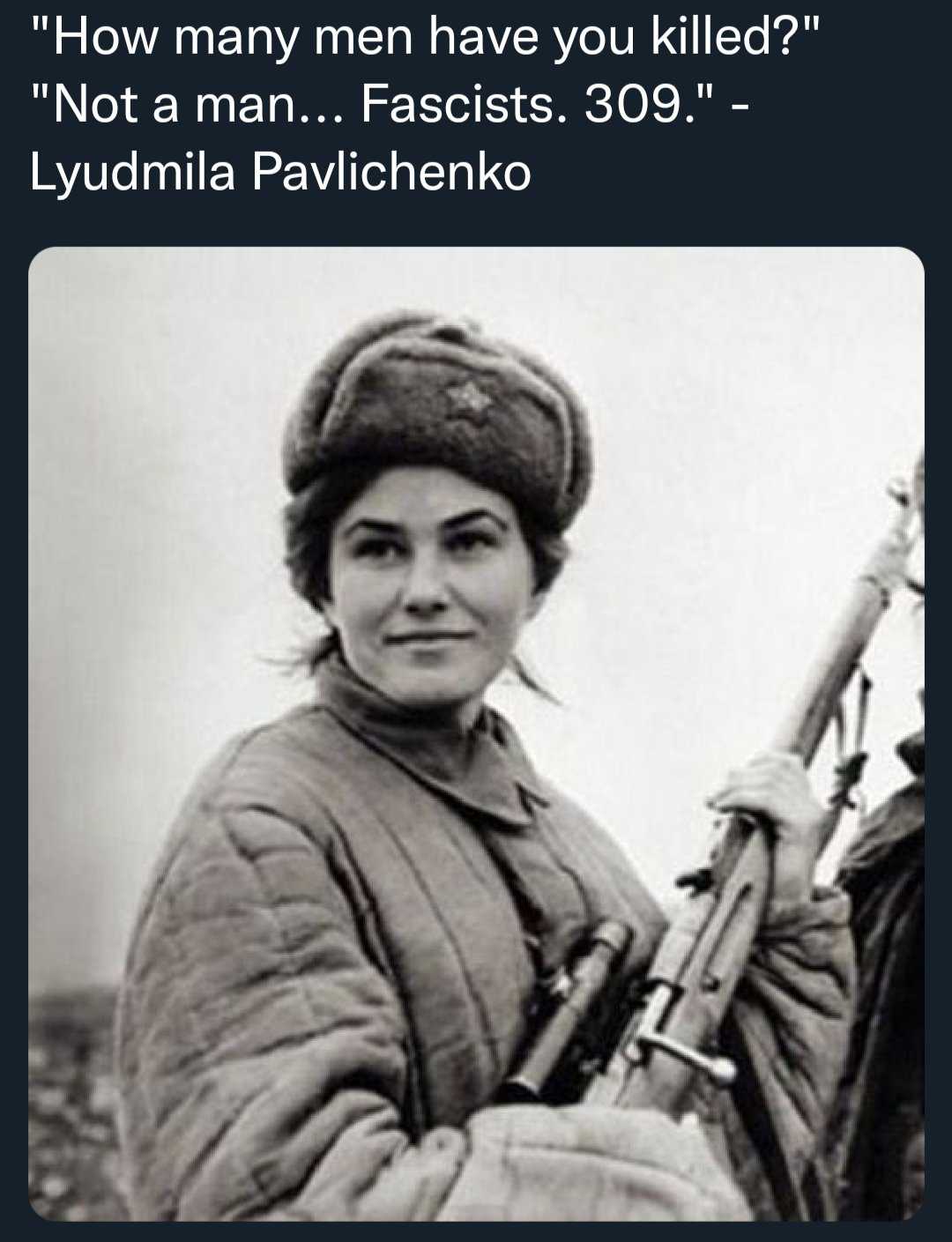 picture of a woman holding a gun in a field