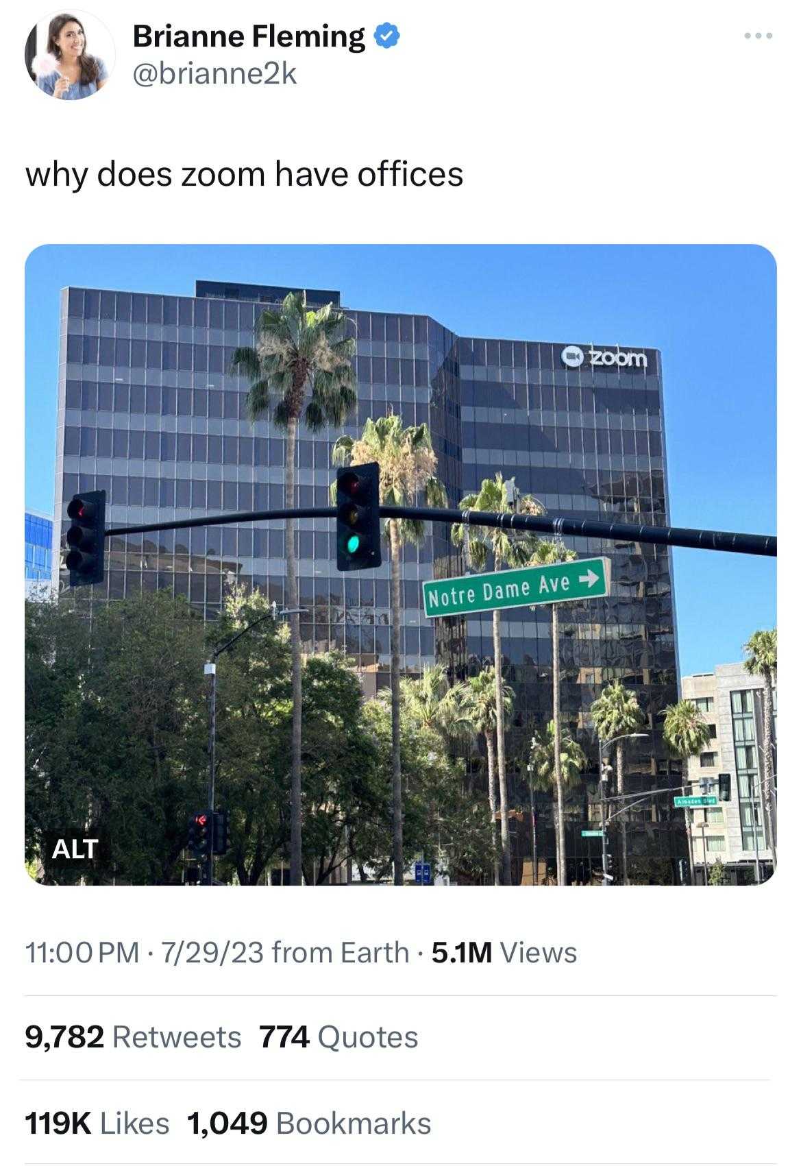 image of a traffic light with a green street sign