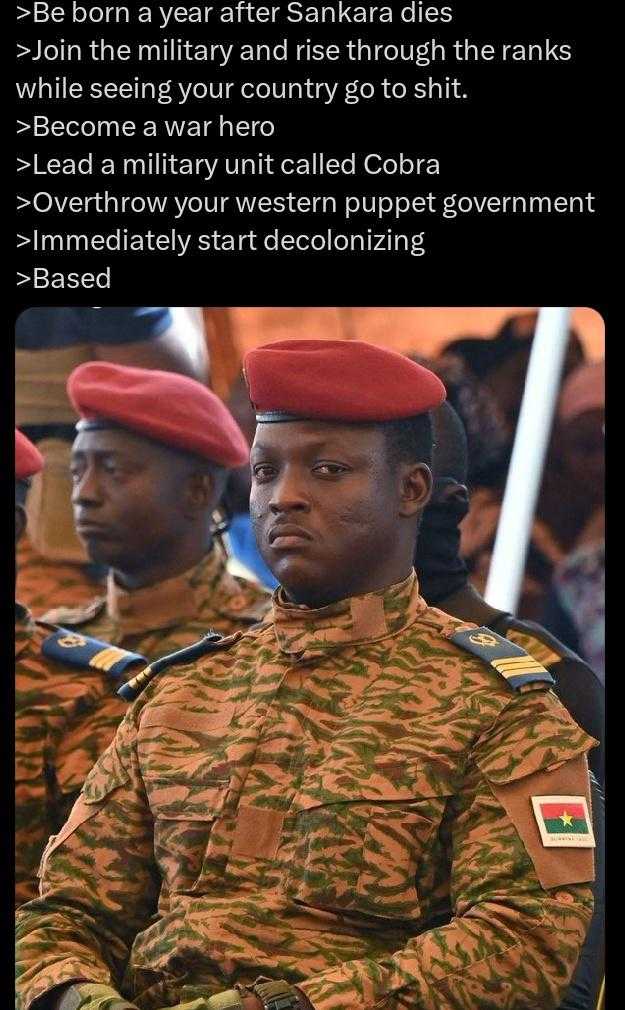 a close up of a person in a uniform with a red beret