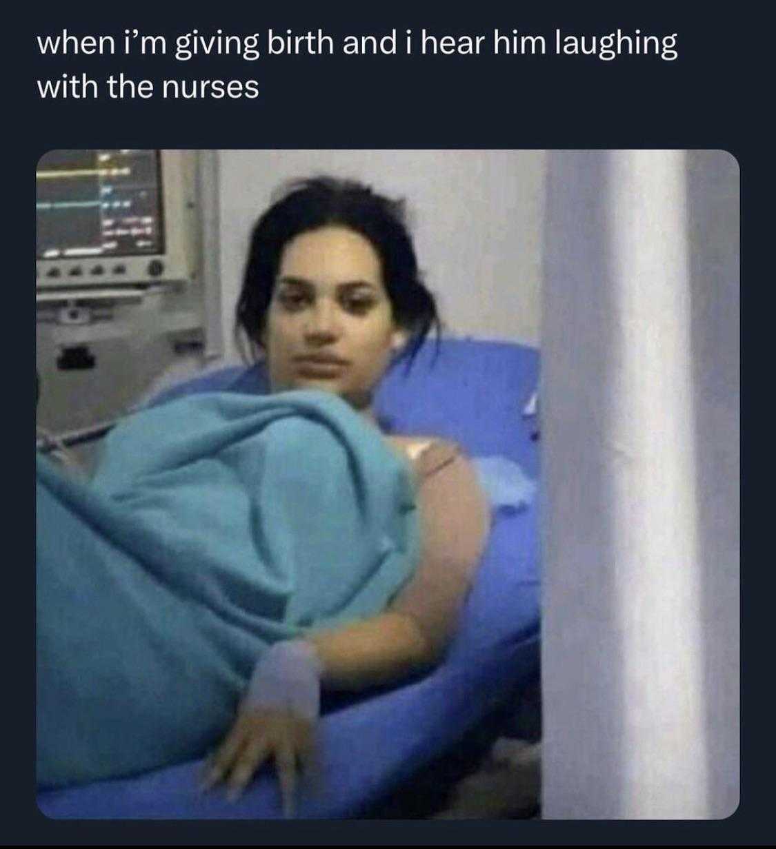 woman laying in hospital bed with blue blanket and a blue blanket