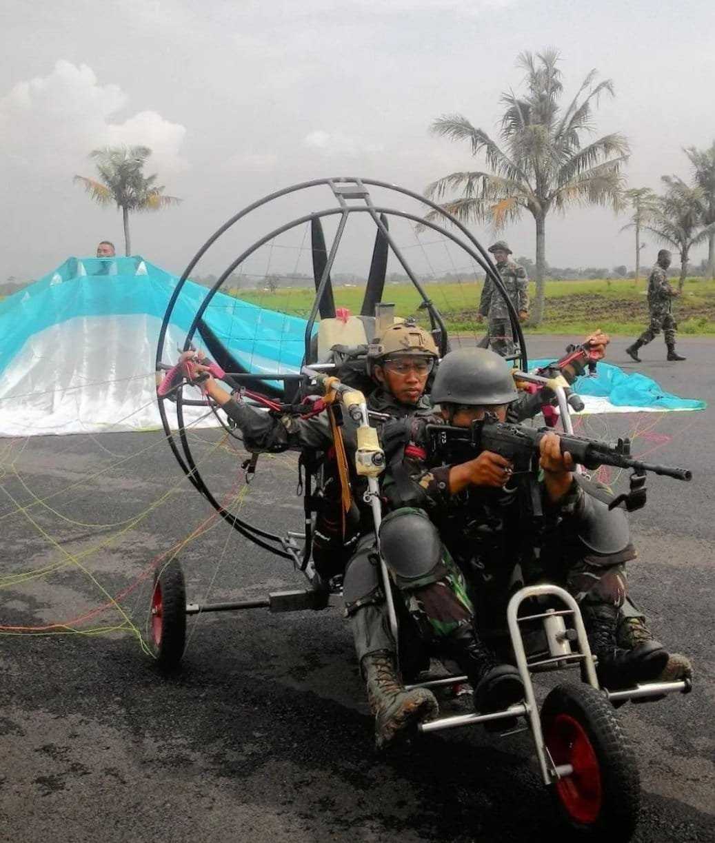 there are two people riding a motorcycle with a man on it