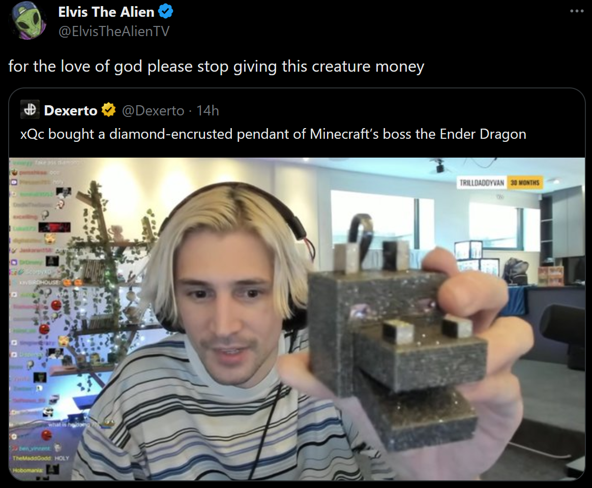 man with headphones holding a rock in front of him