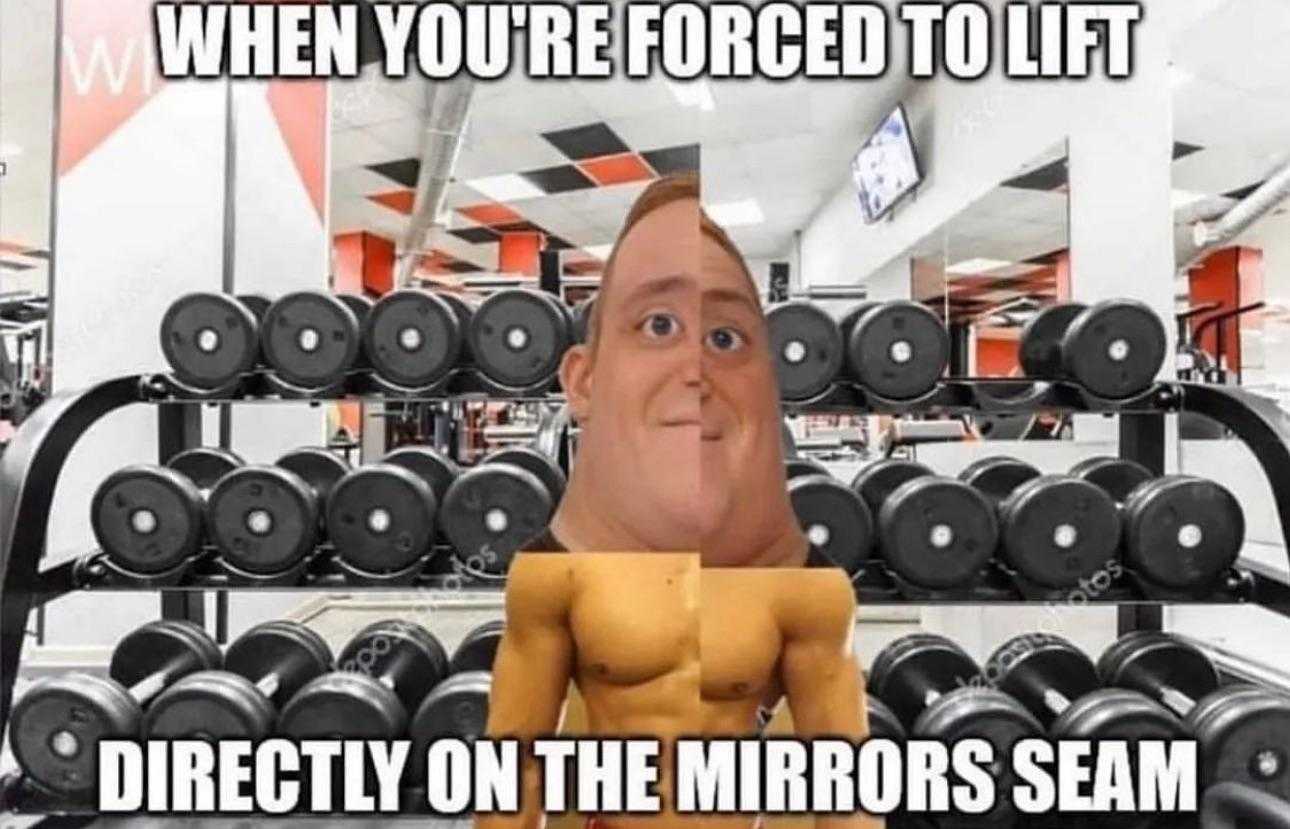 a picture of a man in a gym with dumbs and a mirror