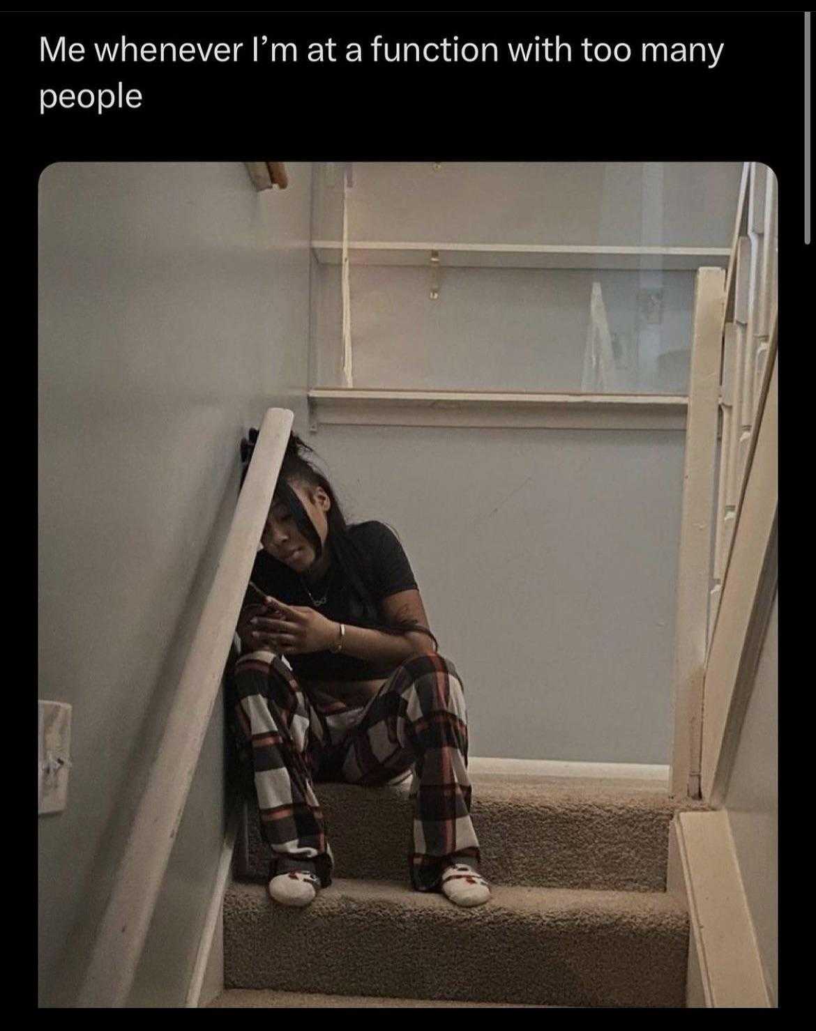 there is a man sitting on the stairs of a house