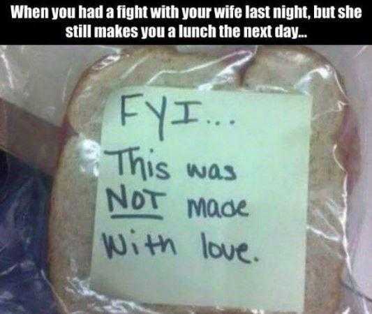 a close up of a sandwich with a note on it