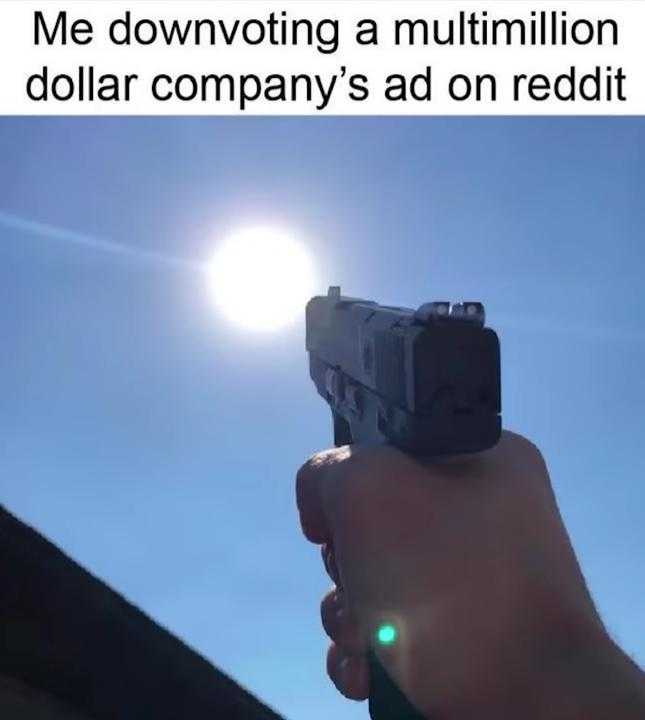 gun in hand with sun in background and caption that reads me dowowing a multimillion dollar company ' s ad on reddit