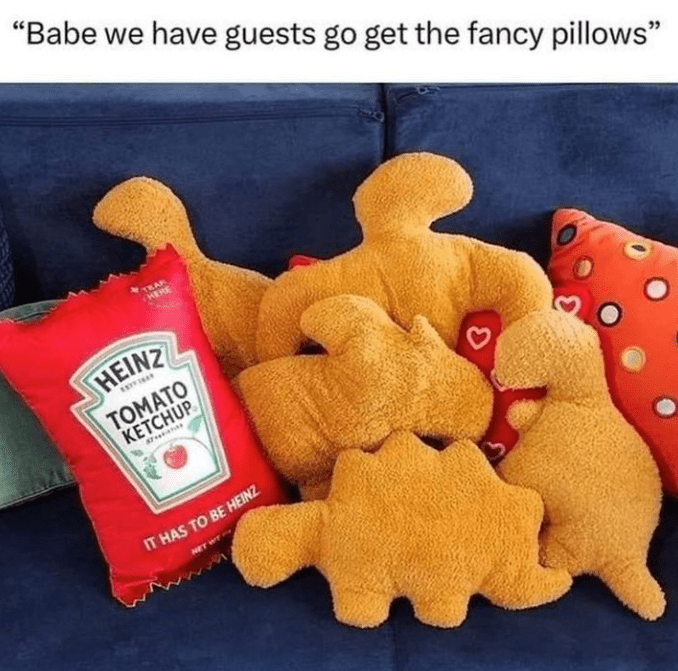 there are a lot of stuffed animals on the couch with ketchup