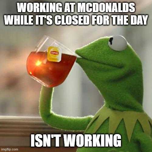 a person drinking tea while looking out the window at mcdonalds while it ' s closed for the day isn ' t working