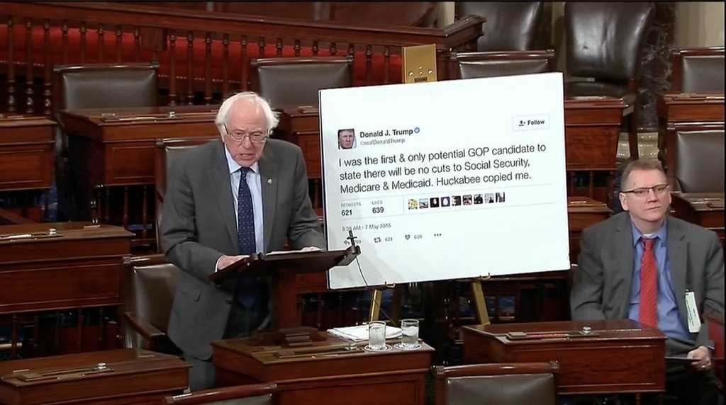 image of a man standing in a room with a sign