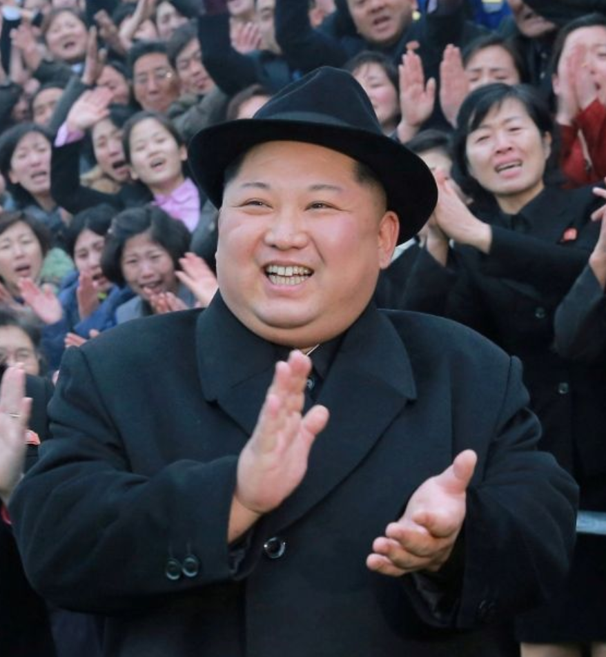 araffed image of a man in a suit and hat clapping