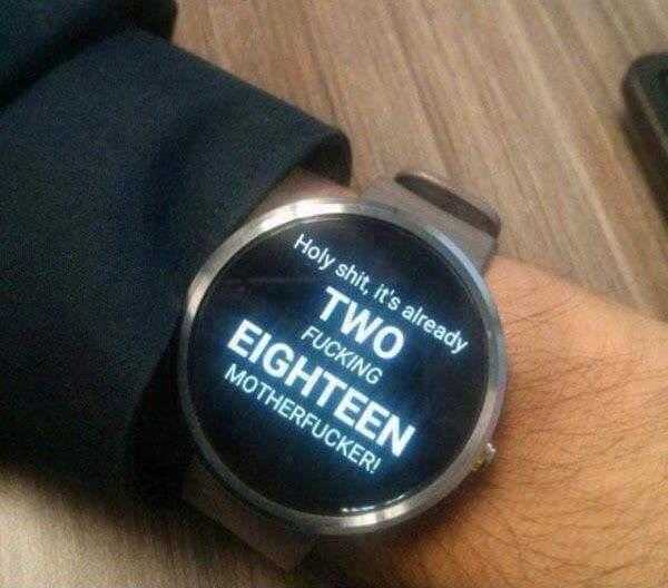 someone is showing off their smart watch with a message on the screen