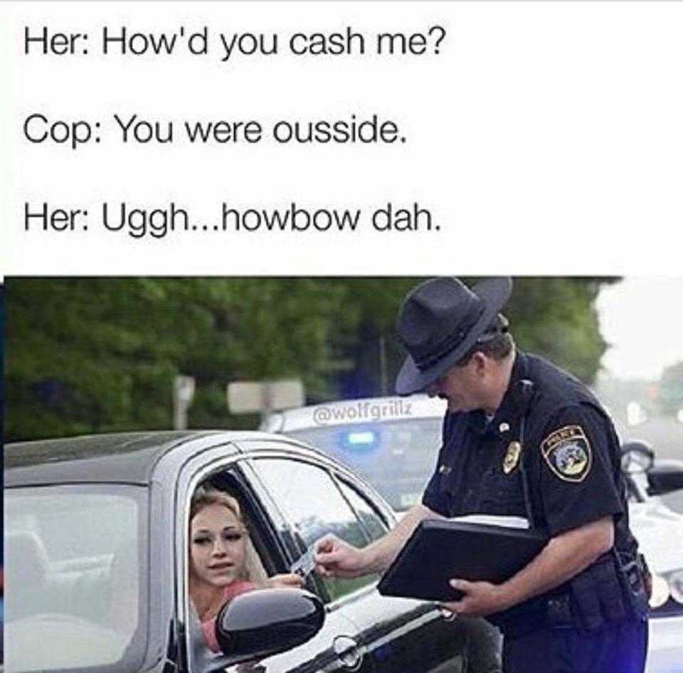 cop checking a woman ' s car ' s cash