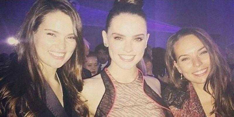 three women posing for a picture at a party