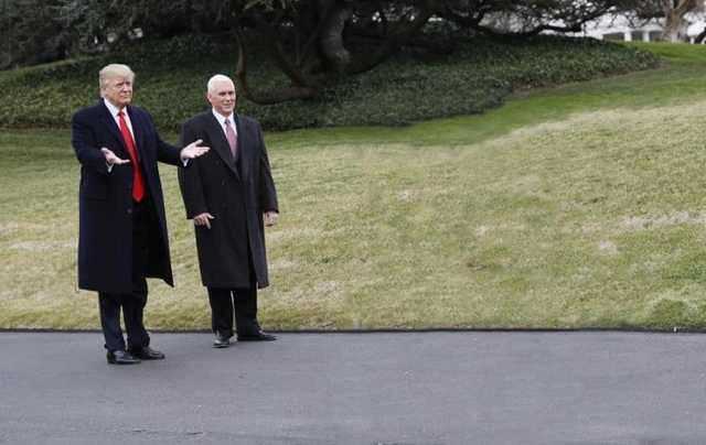 two men in suits and ties standing in the middle of a road