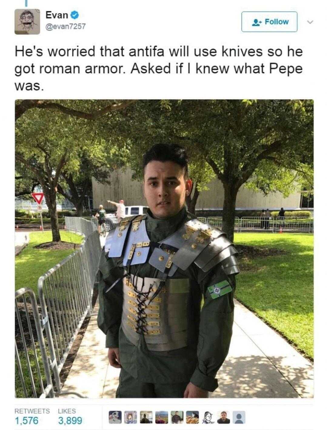 man in armor standing on sidewalk with trees in background