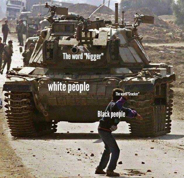 tank with a man standing in front of it with a caption that reads, the word ' nigger ' white people black people