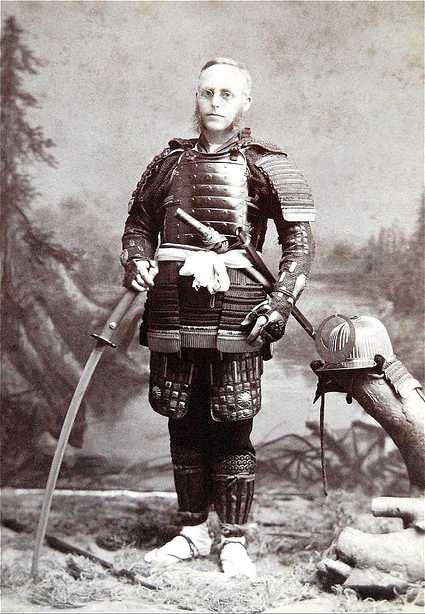 man in a samurai costume holding a sword and a helmet