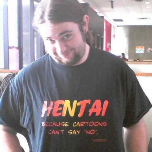 man with a beard and a black shirt with a sign on it