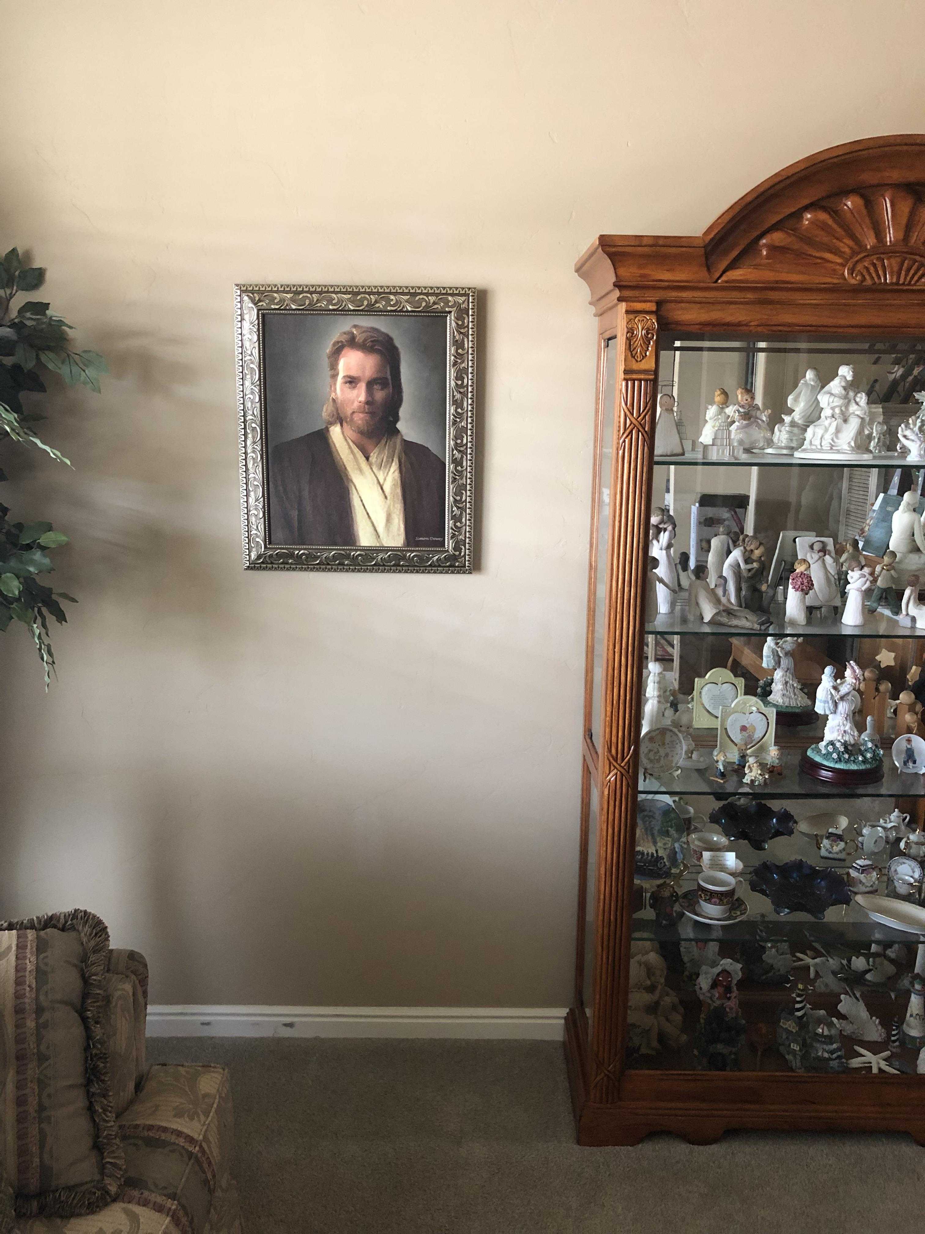 there is a picture of a man in a suit and tie in a cabinet