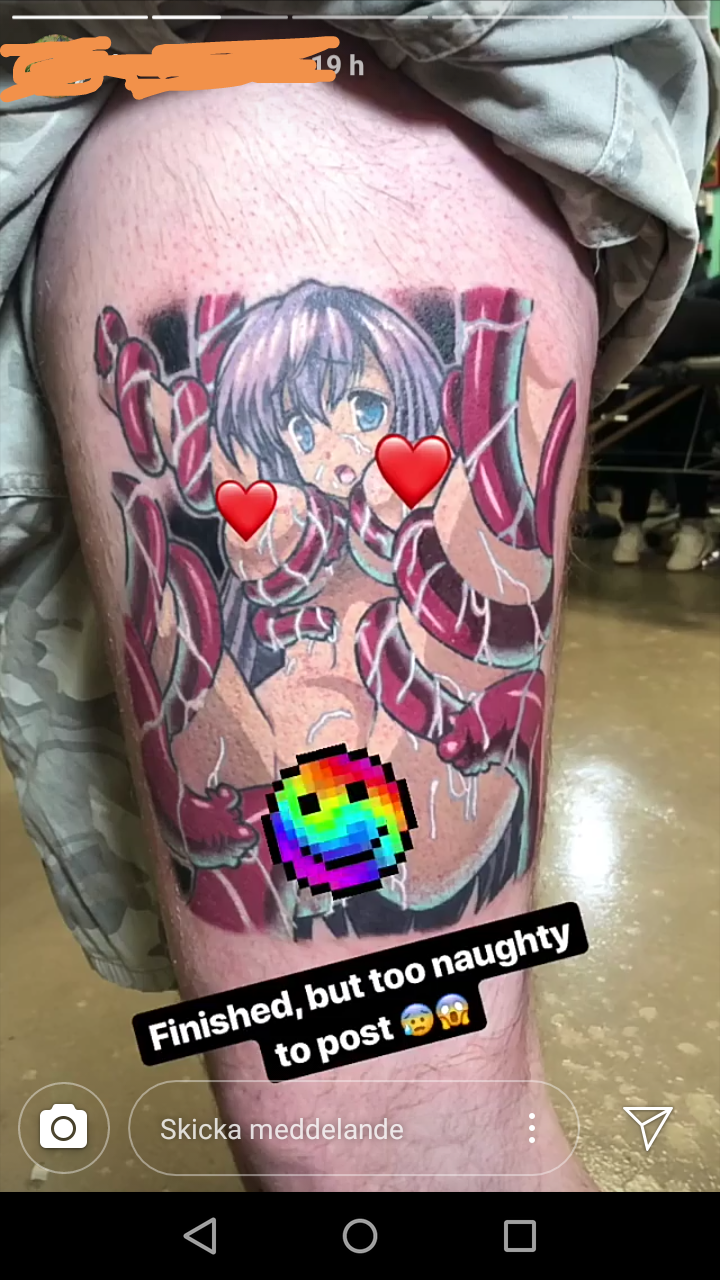 someone has a tattoo of a girl with hearts on her thigh