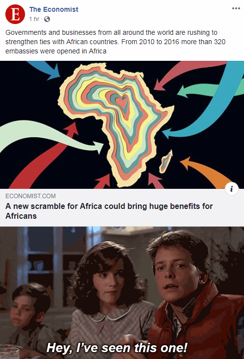 a screenshot of a man and woman sitting at a table with a map of africa