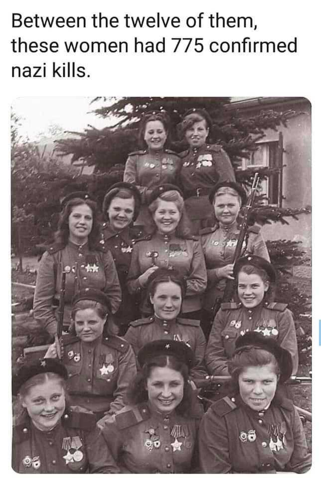 there are many women in uniform posing for a picture together