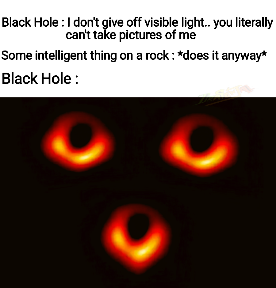 a close up of a black hole with a black hole in the middle